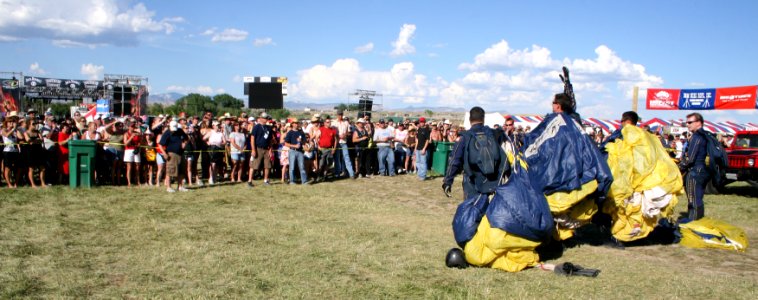 US Navy 090628-N-5366K-039 Chief Special Warfare Operator (SEAL) William Davis, assigned to the U.S. Navy Parachute Team, the Leap Frogs, waves to spectators after a demonstration jump during Military Appreciation Day
