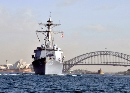 US Navy 090701-N-2638R-003 The guided-missile destroyer USS Mustin (DDG 89) transits through Sydney Harbor after completing a scheduled port visit in Sydney, Australia photo