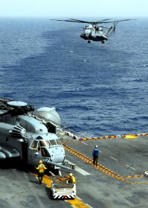 US Navy 090701-N-3165S-192 A CH-53E Super Stallion helicopter prepares to land aboard the amphibious assault ship USS Bataan (LHD 5)
