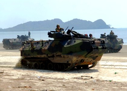 US Navy 090629-N-5207L-232 Amphibious assault vehicles transport U.S. Marines and Malaysian Army soldiers from the 9th Royal Malay Regiment along Resang Beach photo