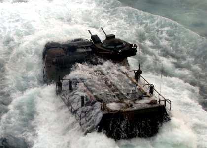 US Navy 090629-N-7058E-042 An amphibious assault vehicle transporting U.S. Marines and Malaysian Army soldiers from the 9th Royal Malay Regiment splashes into the water after launching