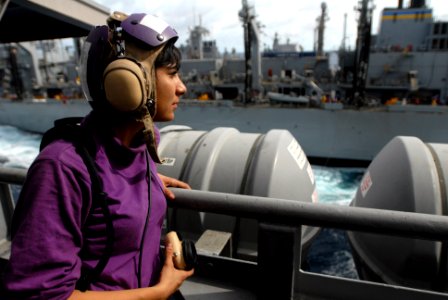 US Navy 090630-N-9132C-026 Aviation Boatswain's Mate (Fuel) Alanna Velasquez stands watch aboard the aircraft carrier USS Ronald Reagan (CVN 76) during a replenishment at sea