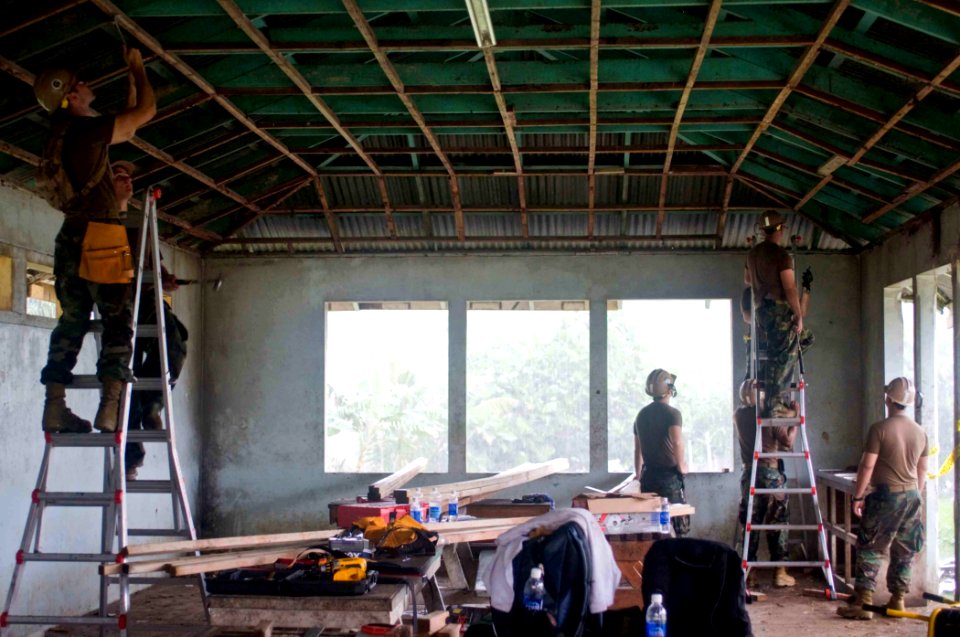 US Navy 090701-N-9689V-004 Seabees assigned to Amphibious Construction Battalion (ACB) 1 and Naval Mobile Construction Battalion (NMCB) 1 renovate a building at Apia National Hospital