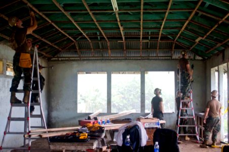 US Navy 090701-N-9689V-004 Seabees assigned to Amphibious Construction Battalion (ACB) 1 and Naval Mobile Construction Battalion (NMCB) 1 renovate a building at Apia National Hospital