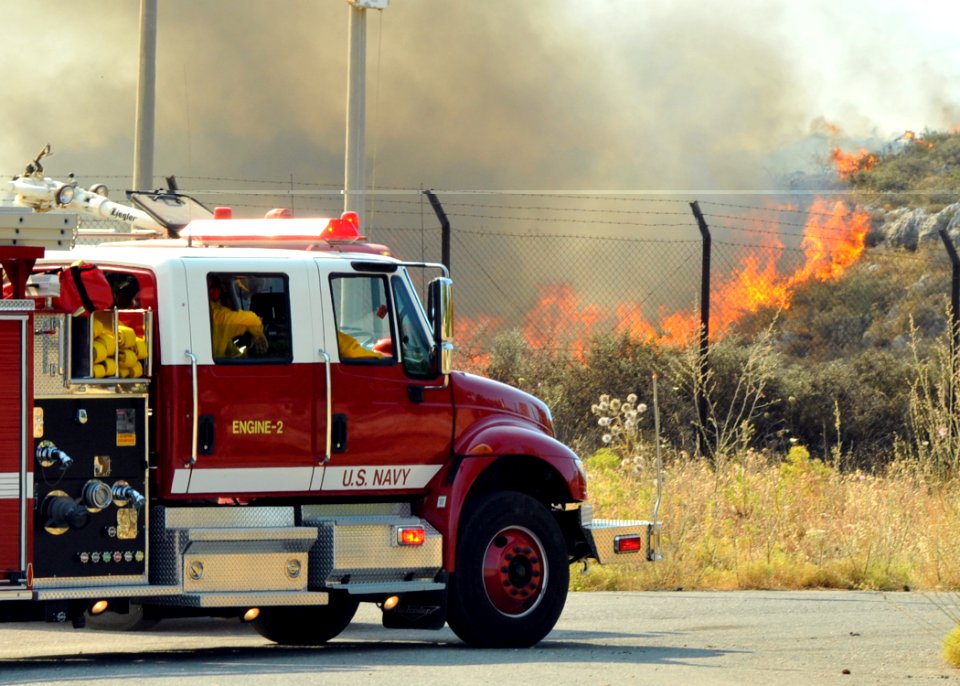 US Navy 090630-N-0780F-001 A U.S. Navy fire engine assigned to U.S. Naval Support Activity Souda Bay arrives at the scene of a large brush fire threatening several local residences and an Hellenic Army installation's fuel stora