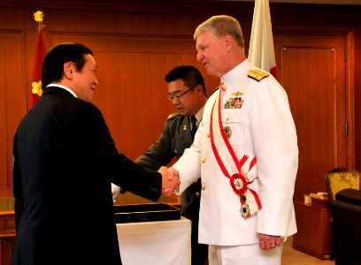 US Navy 090703-N-8273J-053 Japan Defense Minister Yasukazu Hamada, left, congratulates Chief of Naval Operations (CNO) Gary Roughead after Roughead was presented with the Grand Cordon of the Rising Sun award