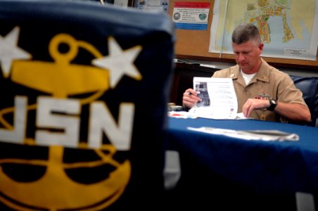 US Navy 090629-N-9818V-409 Master Chief Petty Officer of the Navy (MCPON) Rick West is given a Homeport Ashore brief by the commanding officer of U.S. Fleet Activities Sasebo