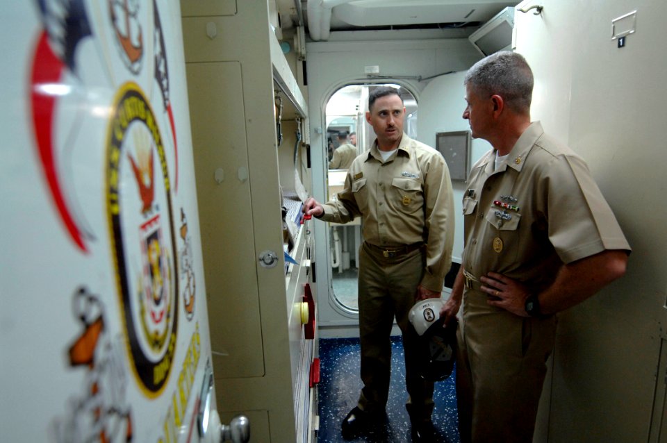 US Navy 090703-N-9818V-118 Command Master Chief John Toomer gives Master Chief Petty Officer of the Navy (MCPON) Rick West a tour of the guided-missile destroyer USS Curtis Wilbur (DDG 54)