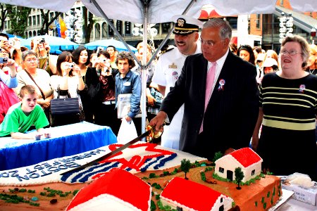 US Navy 090630-N-8110K-041 Cmdr. William Bullard, left, commanding officer of the USS Constitution, Boston Mayor Thomas Menino, and Susan Park, Director of Boston Harborfest, cut the cake during the opening ceremony