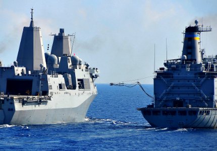 US Navy 090702-N-4774B-083 Amphibious transport dock ship USS New Orleans (LPD 18) receives a fuel line from fleet replenishment oiler USNS Tippecanoe (T-AO 199) during an underway replenishment