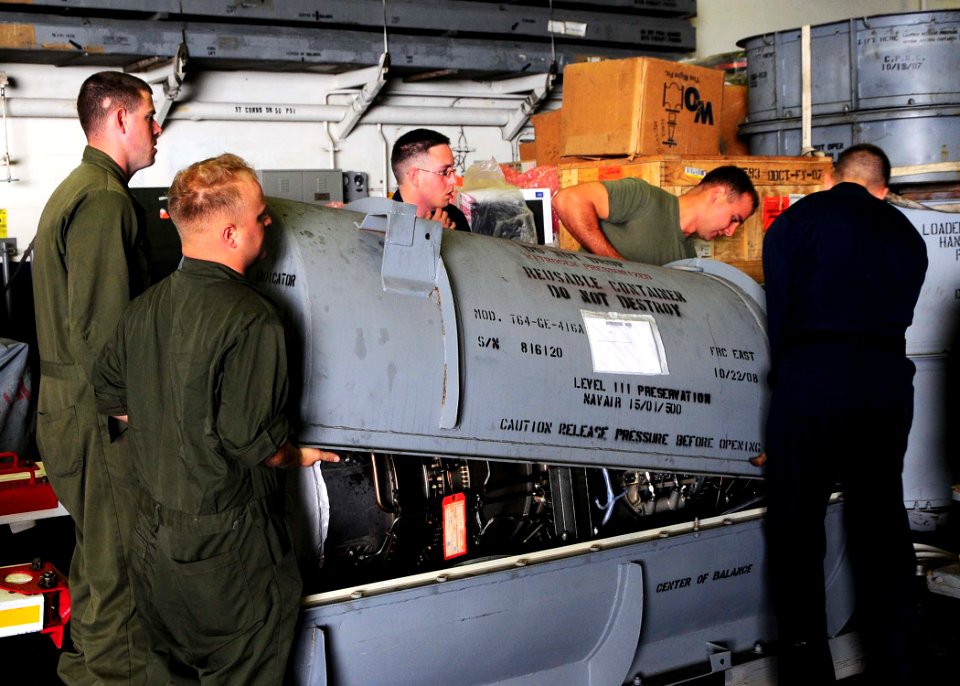 US Navy 090705-N-8607R-005 Sailors and Marines assigned to the Aircraft Intermediate Maintenance Department (AIMD) aboard the amphibious assault ship USS Bonhomme Richard (LHD 6) remove the engine can of a T-64 engine