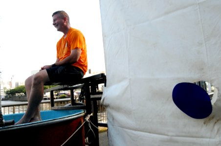 US Navy 090704-N-9818V-625 Master Chief Petty Officer of the Navy (MCPON) Rick West takes part of the 4th of July festivities and sits on the dunk tank at Commander Fleet Activities Yokosuka, Japan photo