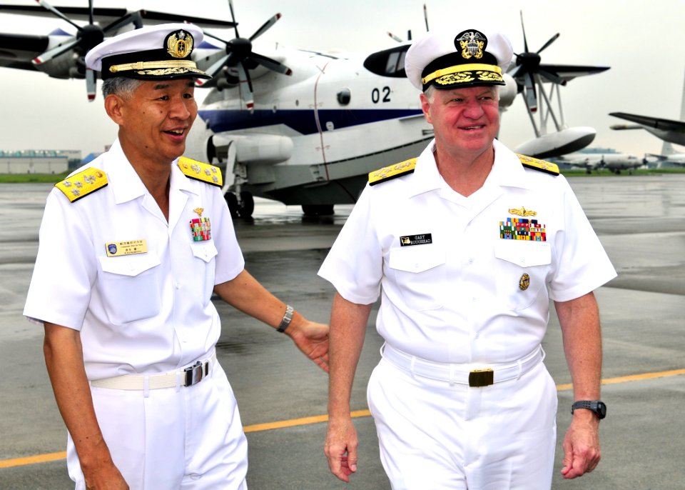 US Navy 090702-N-4031K-005 Vice Adm. Kenichi Kuramoto, commander of the Japan Maritime Self-Defense Force Fleet Air Force, welcomes Chief of Naval Operations (CNO) Adm. Gary Roughead to Naval Air Facility Atsugi