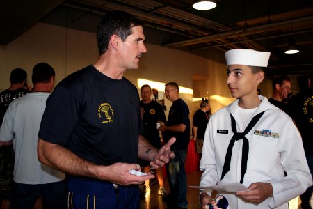 US Navy 090702-N-5366K-333 Chief Special Warfare Operator (SEAL) William Davis, assigned to the U.S. Navy Parachute Team the Leap Frogs, talks to a U.S. Navy Sea Cadet Corps cadet from the Seal Beach Battalion photo