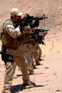 US Navy 090705-N-5710P-135 U.S. Navy explosive ordnance disposal technicians demonstrate a course of combat marksmanship using the M4 service rifle as part of a course of instruction on basic combat marksmanship during operatio
