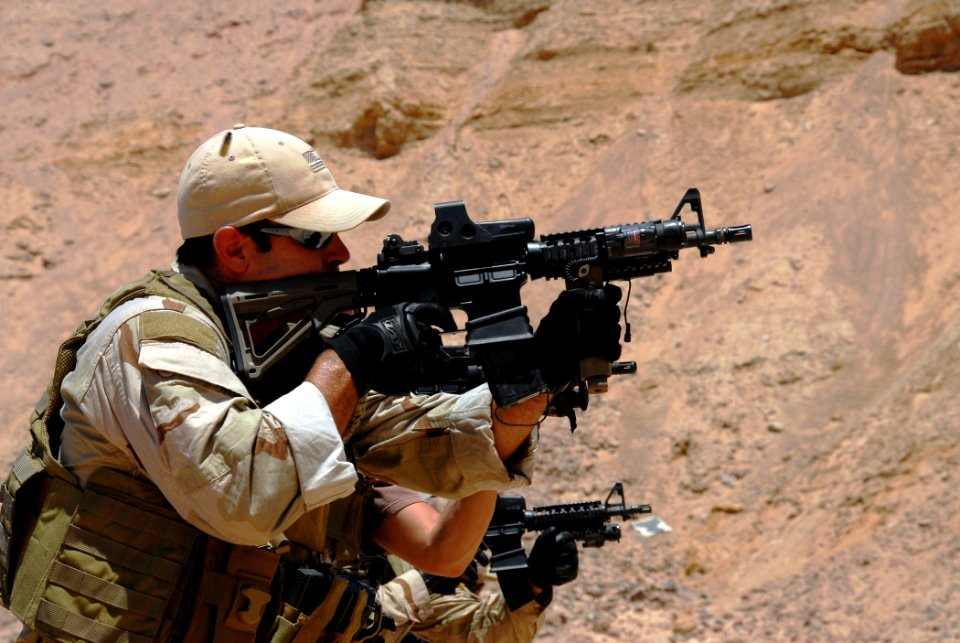 US Navy 090705-N-5710P-127 Lt. Cole Evans, an explosive ordnance disposal technician, demonstrates proper handling and firing of the CQBR service rifle as part of a course on basic combat marksmanship during operation Infinite Re