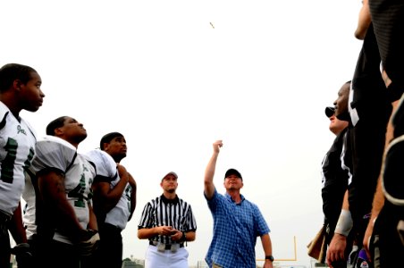 US Navy 090704-N-9818V-494 Master Chief Petty Officer of the Navy (MCPON) Rick West tosses the coin for the Yokosuka Seahawks and Misawa Jets football game at Commander Fleet Activities Yokosuka, Japan