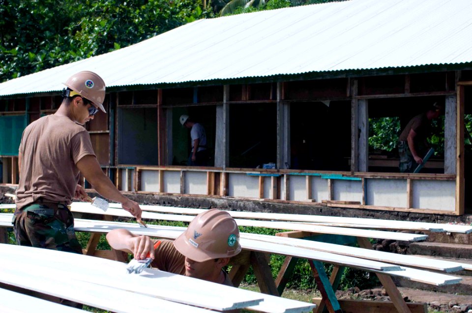 US Navy 090703-N-9689V-008 Seabees of Amphibious Construction Battalion (ACB) 1 and Naval Mobile Construction Battalion (NMCB) 1 renovate the assembly hall at the Sasina Primary School during a Engineering Civic Action Project