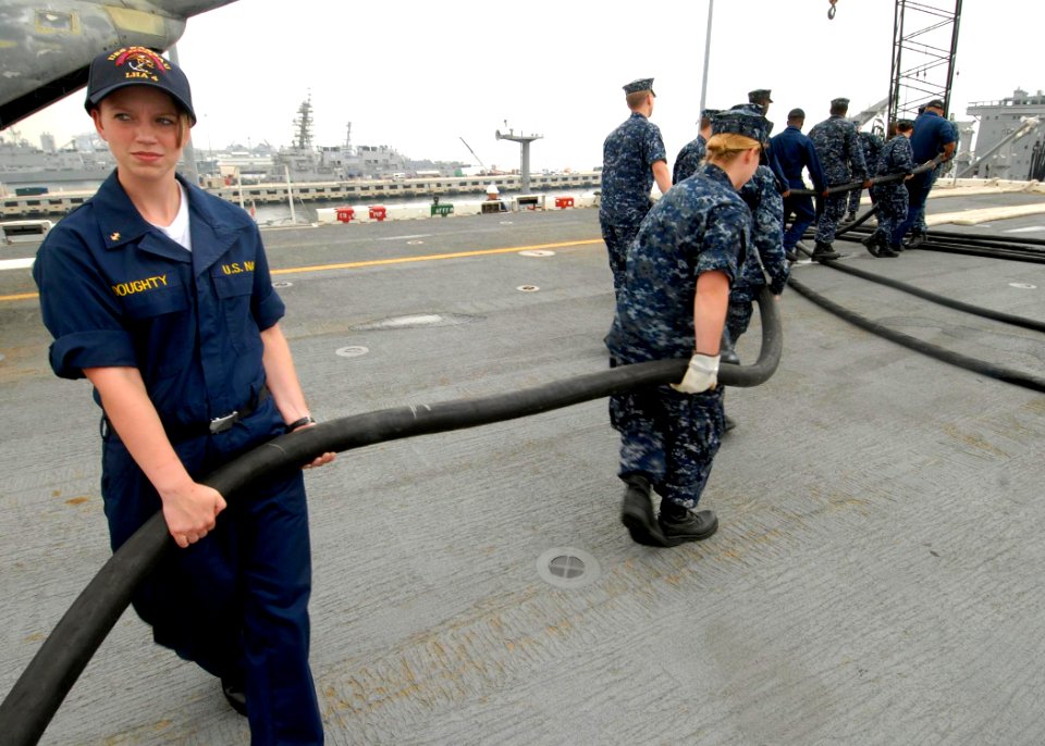 US Navy 090706-N-6439C-014 Midshipman 3rd Class Kimberly Doughty, from the U.S. Naval Academy, participates in a shore power working party
