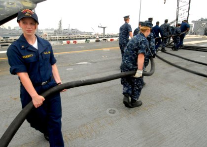 US Navy 090706-N-6439C-014 Midshipman 3rd Class Kimberly Doughty, from the U.S. Naval Academy, participates in a shore power working party