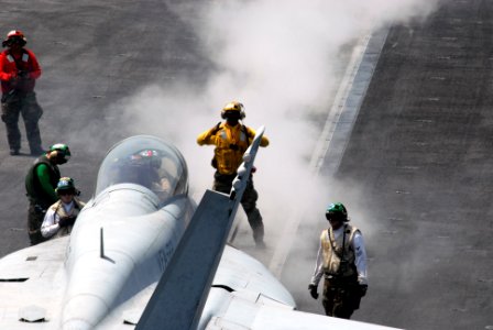 US Navy 090706-N-5586R-010 An F-A-18F Super Hornet assigned to the Fighting Redcocks of Strike Fighter Squadron (VFA) 22 is prepared for launch from the aircraft carrier USS Ronald Reagan (CVN 76)