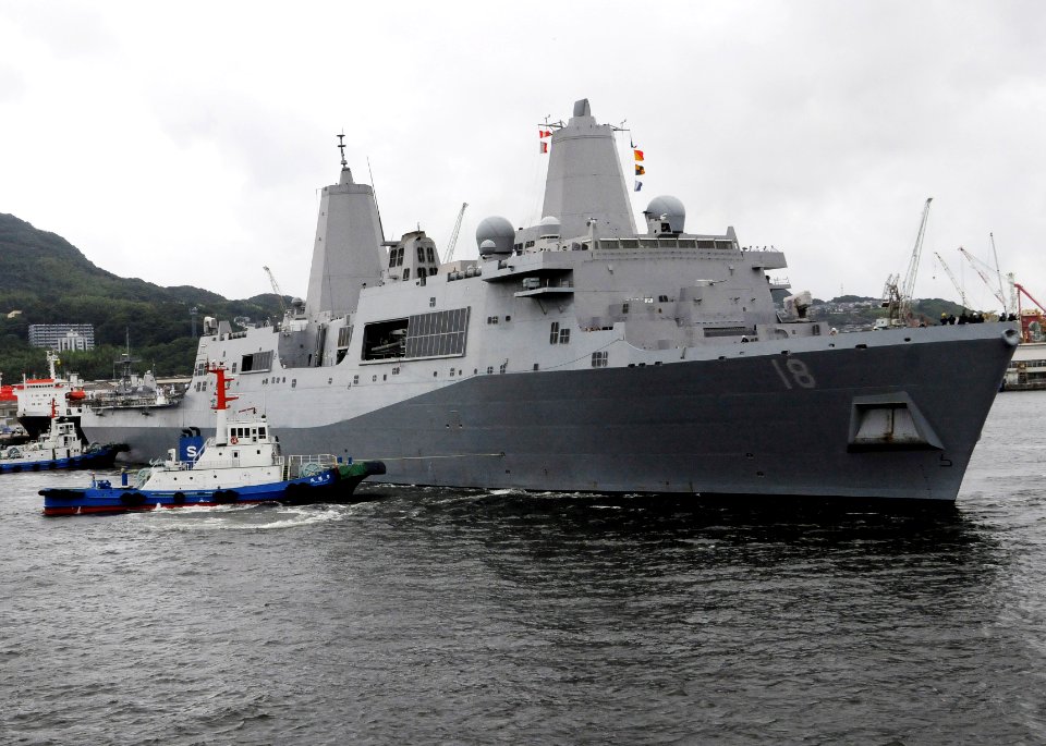 US Navy 090708-N-0807W-137 Tugboats guide the amphibious transport dock ship USS New Orleans (LPD 18) as the ship arrives in Sasebo for a scheduled port visit