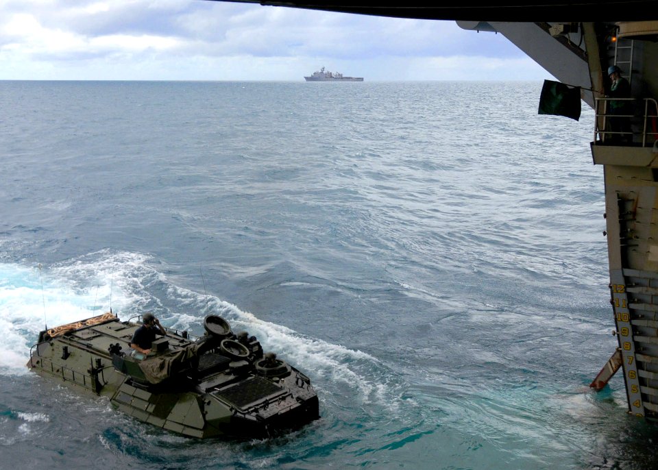 US Navy 090708-N-0120A-043 Marines assigned to the 31st Marine Expeditionary Unit (MEU) embark the forward-deployed amphibious assault ship USS Essex (LHD 2) in an Amphibious Assault Vehicle (AAV)