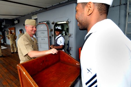 US Navy 090706-N-3830J-009 Master Chief Petty Officer of the Navy (MCPON) Rick West speaks with the Messenger of the Watch during his visit aboard the amphibious command ship USS Blue Ridge (LCC 19)