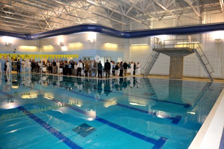 US Navy 090709-N-8848T-471 Guests tour the new Lt. Michael Murphy Combat Training Pool during a dedication ceremony at Officer Training Command, Newport photo