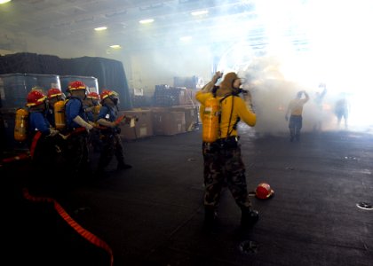 US Navy 090710-N-1062H-005 Sailors simulate fighting a fire during a mass casualty drill aboard the aircraft carrier USS George Washington (CVN 73)
