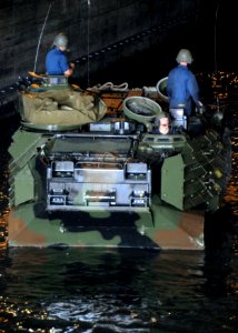 US Navy 090708-N-0120A-056 Marines assigned to the 31st Marine Expeditionary Unit (MEU) turn their Amphibious Assault Vehicle (AAV) around in the well deck of the forward-deployed amphibious assault ship USS Essex (LHD 2) photo