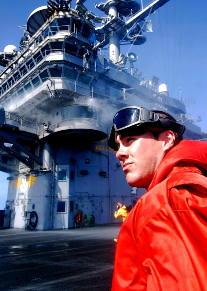 US Navy 090707-N-6538W-227 Aviation Boatswain's Mate (Handling) Airman Kenneth Shaffer, from Milwaukee, checks sprinklers on the island aboard the aircraft carrier USS John C. Stennis (CVN 74) during a counter-measure wash down