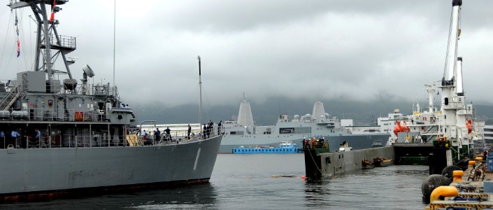 US Navy 090710-N-0807W-474 The mine countermeasures ship USS Avenger (MCM 1) exits the submerged deck of the Military Sealift Command contracted heavy-lift vessel Ocean Force during a float-on-float-off evolution in Sasebo