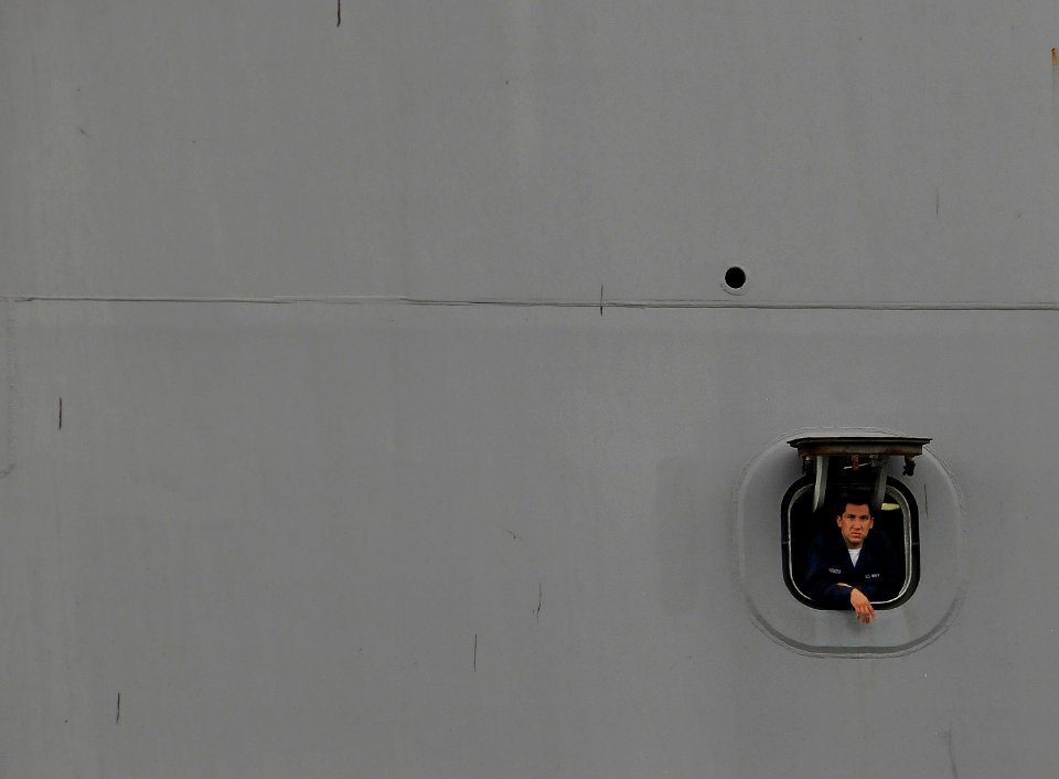 US Navy 090708-N-0807W-247 A Sailor assigned to the amphibious transport dock ship USS New Orleans (LPD 18) looks out from a mooring station during sea and anchor detail as the ship arrives in Sasebo for a scheduled port visit