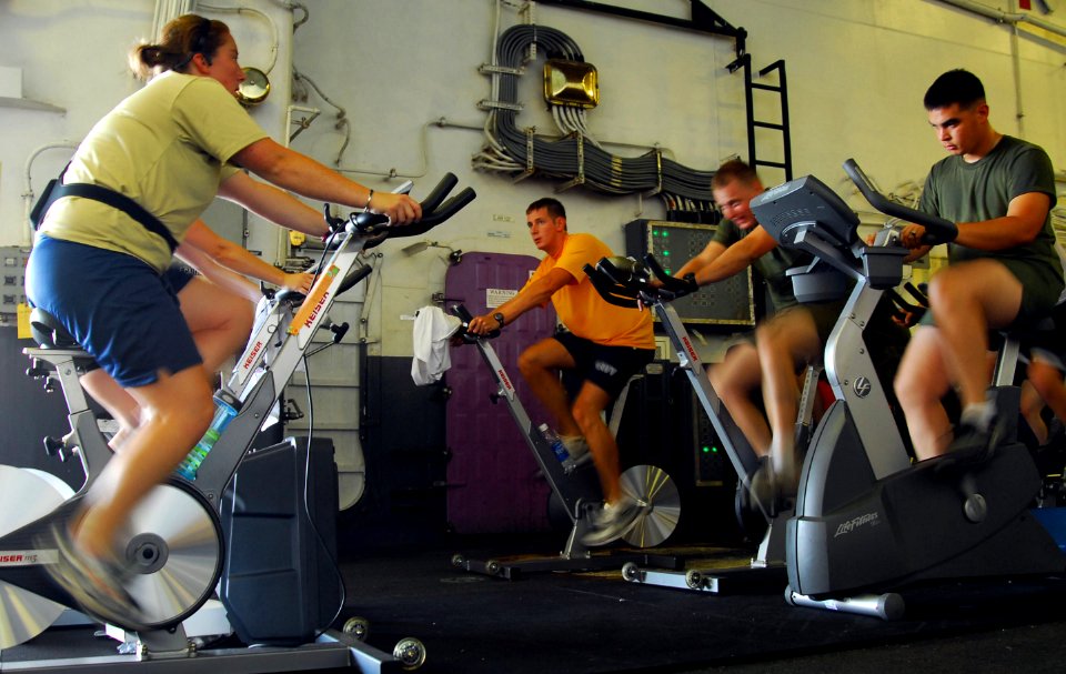 US Navy 090707-N-0515W-019 Sailors and Marines work out during a spin class aboard the amphibious assault ship USS Bonhomme Richard (LHD 6)