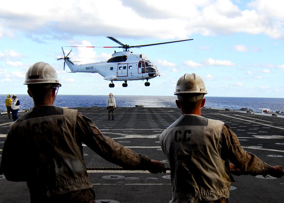 US Navy 090706-N-5538K-133 Marines assigned to the 31st Marine Expeditionary Unit seat a fuel probe on the port side of the amphibious transport dock ship USS Denver (LPD 9)