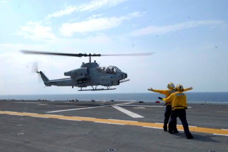 US Navy 090707-N-3592S-008 An AH-1 Cobra helicopter assigned to Marine Medium Tiltrotor Squadron 162 based in New River, N.C. lifts off from the flight deck of the amphibious assault ship USS Nassau (LHA 4)