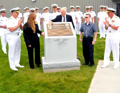 US Navy 090709-N-8848T-438 Daniel Murphy touches a plaque dedicated to his son, U.S. Navy Lt. Michael P. Murphy