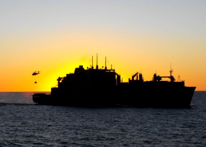 US Navy 090711-N-2406S-002 An MH-60S Sea Hawk helicopter assigned to the Island Knights of Helicopter Combat Squadron (HSC) 25, transfers stores from the Military Sealift Command dry cargo-ammunition ship USNS Alan Shepard (T-A