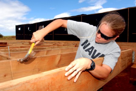 US Navy 090710-N-0535P-025 Naval Aircrewman 2nd Class Mehgan Rodriguez works on a deck during a home build