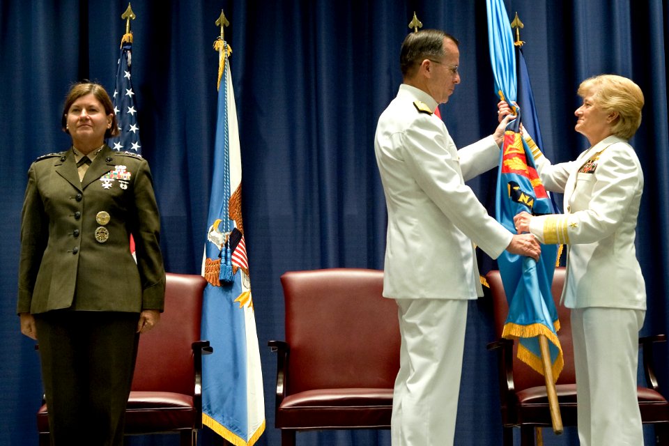 US Navy 090710-N-0696M-059 Navy Adm. Mike Mullen, chairman of the Joint Chiefs of Staff passes the colors to U.S. Navy Vice Adm. Anne Rondeau at the National Defense University