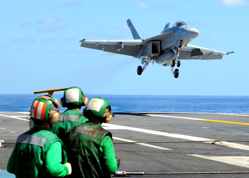 US Navy 100922-N-6632S-232 Sailors assigned to the air department of the aircraft carrier USS George H.W. Bush (CVN 77) observe an F-A-18E Super Ho