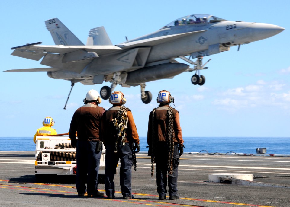 US Navy 100922-N-6632S-656 Sailors assigned to the air department of the aircraft carrier USS George H.W. Bush (CVN 77) observe an F-A-18F Super Ho