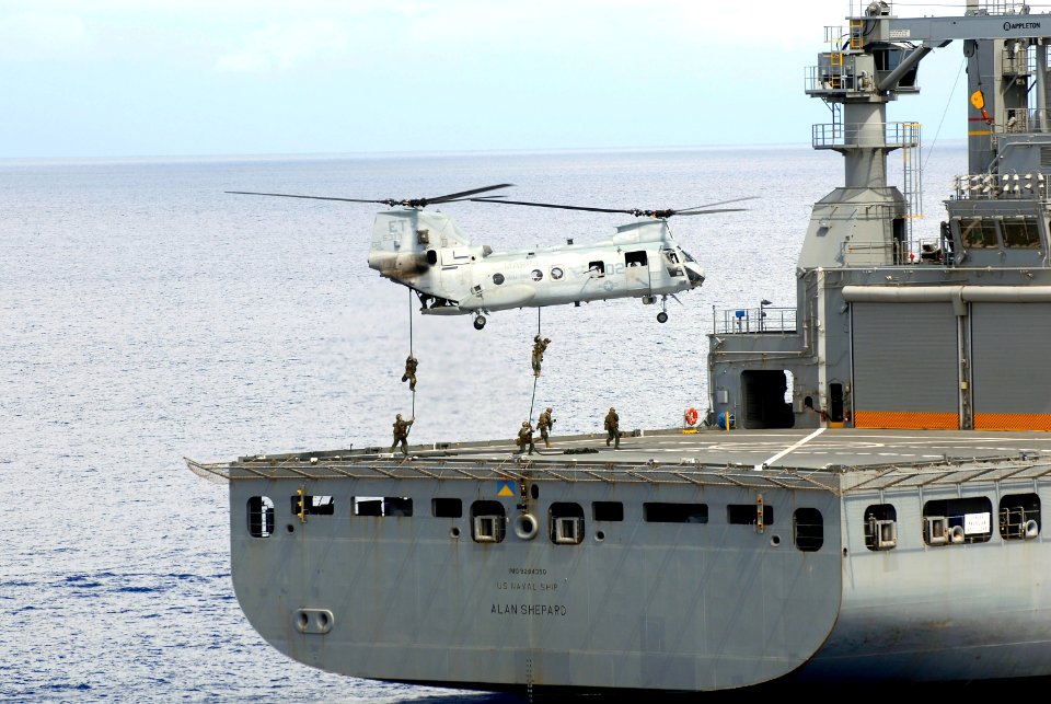 US Navy 100918-N-8335D-318 Marines assigned to the 31st Marine Expeditionary Unit (31st MEU) fast rope from a CH-46 Sea Knight helicopter onto the