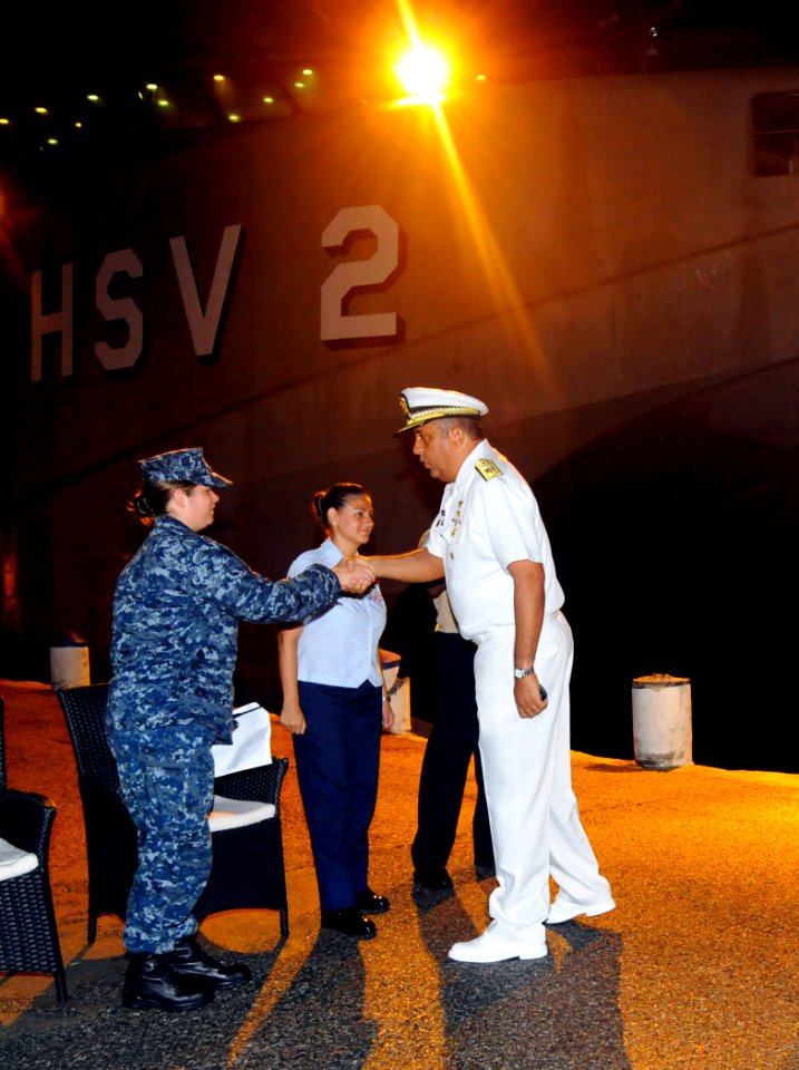 US Navy 100923-N-9643W-016 Lt. j.g. Joan Mulligan, from Annapolis, Md., greets an officer from the Dominican Republic navy on the pier before a dis