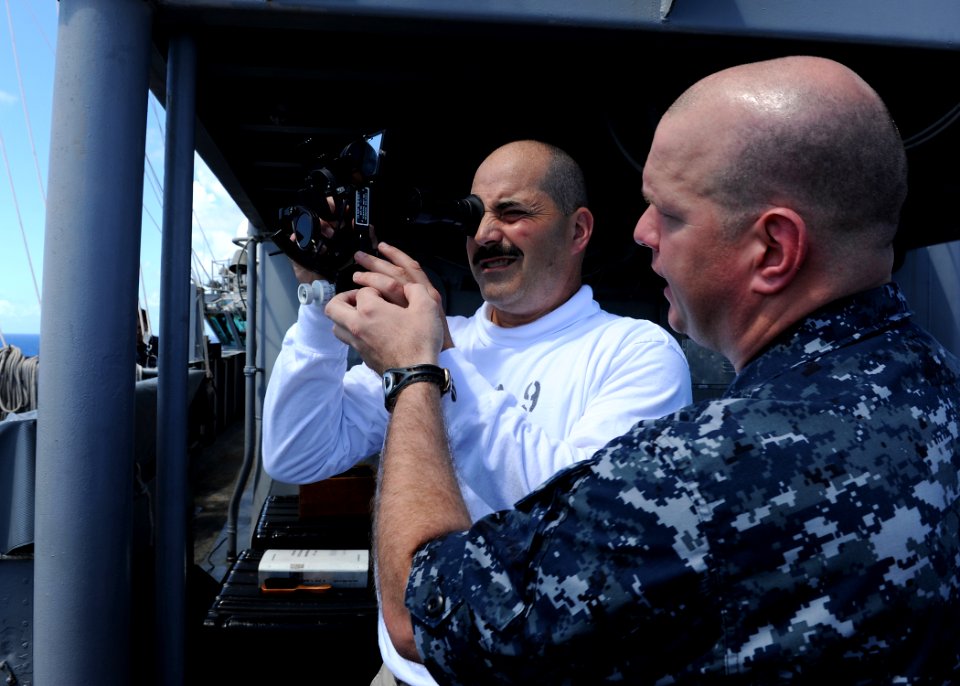 US Navy 100925-N-2821G-034 Rear Adm. Mark D. Guadagnini, left, commander of the Abraham Lincoln Carrier Strike Group,