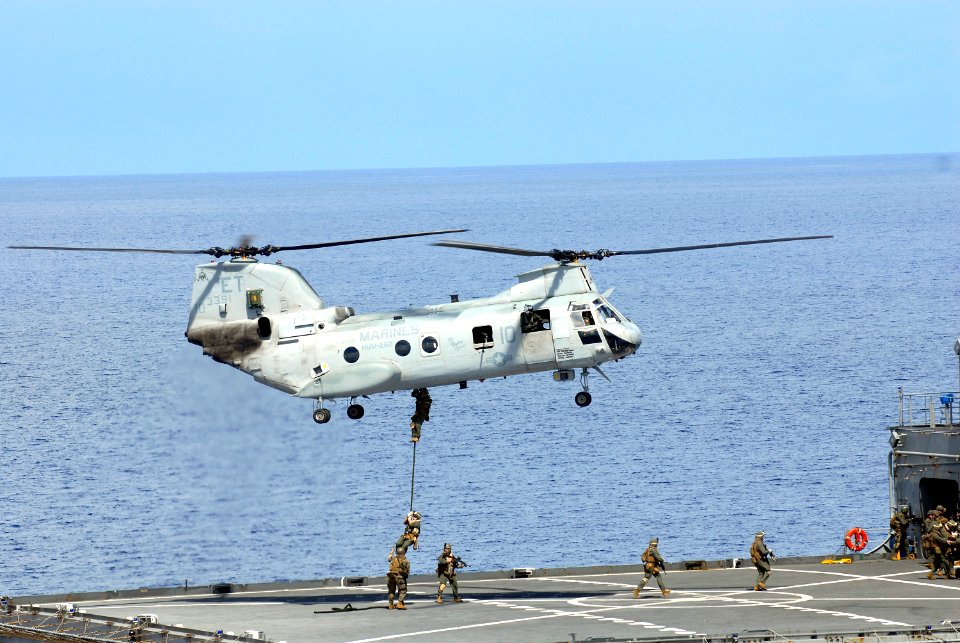 US Navy 100918-N-8335D-500 Marines assigned to the 31st Marine Expeditionary Unit (31st MEU) fast rope from a CH-46 Sea Knight helicopter onto the