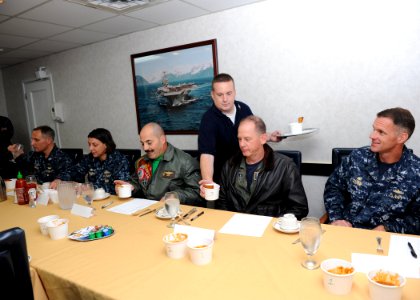 US Navy 100920-N-4973M-039 Culinary Specialist 1st Class Thomas Helms, from Long Island, N.Y., serves chili