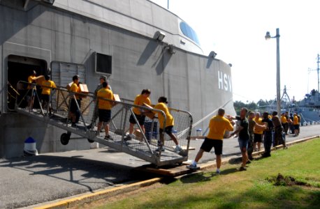 US Navy 100919-N-4971L-036 Personnel embarked aboard High Speed Vessel Swift (HSV 2) unload pallets of Project Handclasp aid to be donated to relie