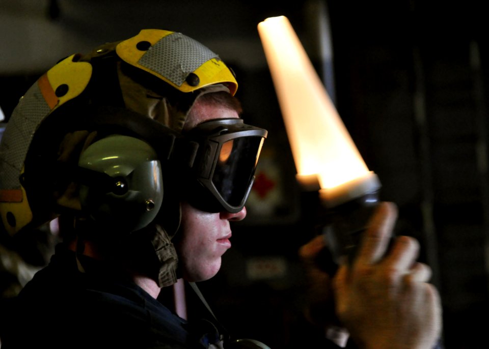 US Navy 100918-N-3620B-016 A Sailor guides a landing craft air cushion aboard USS Denver